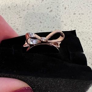 Kate Spade “bow” rose gold costume ring.